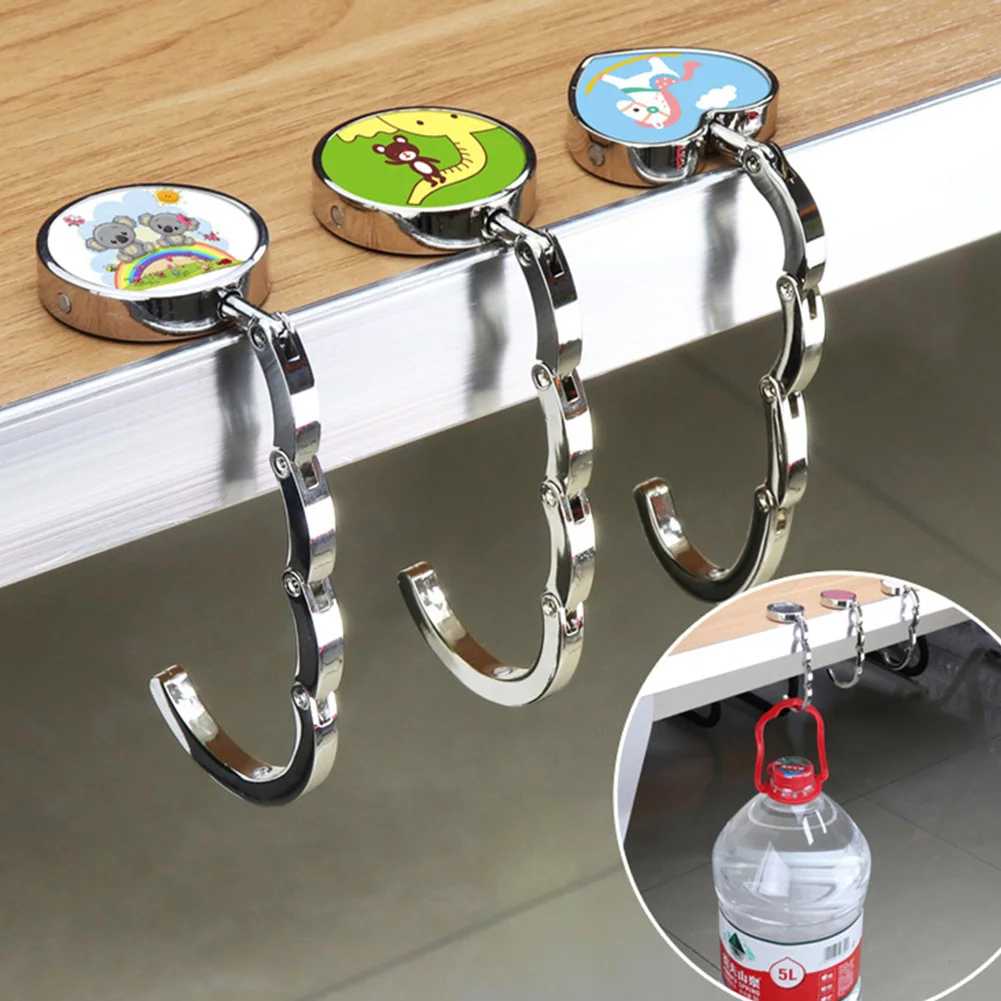 1pcs Portable Bag Hook Holder Folding Handbag Bag Key Ring Hanger Hook Holder Table Hook Bag Storage Organizer Accessories
1pcs Portable Bag Hook Holder Folding Handbag Bag Key Ring Hanger Hook Holder Table Hook Bag Storage Organizer Accessories
