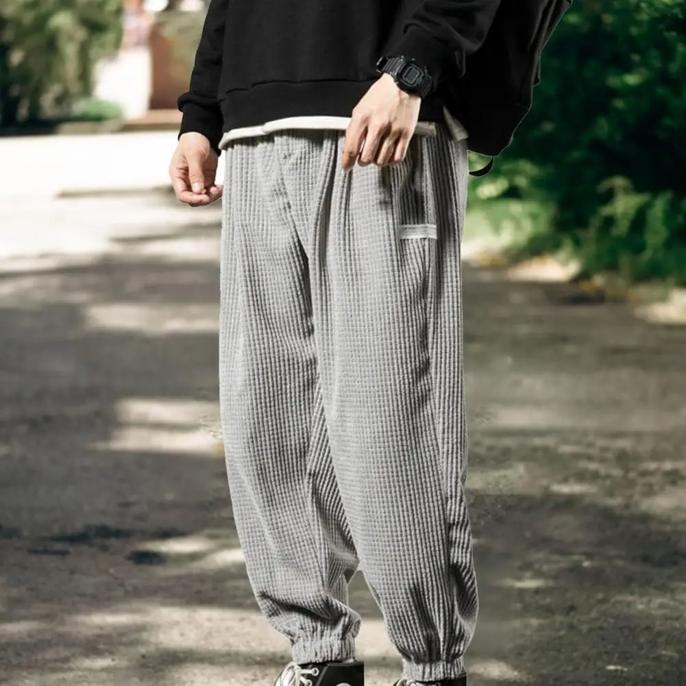 Casual Men Autumn Pants Solid Color Drawstring Pockets Loose Ankle Tied Mid Waist Trousers Male Clothing Streetwear
Casual Men Autumn Pants Solid Color Drawstring Pockets Loose Ankle Tied Mid Waist Trousers Male Clothing Streetwear