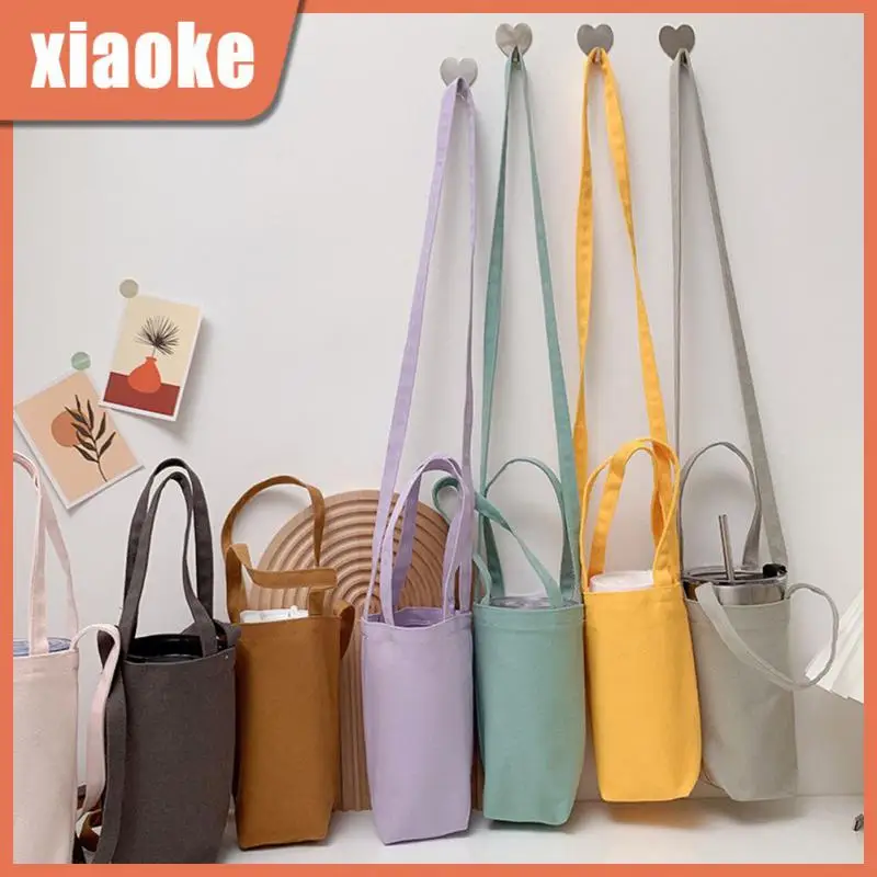 Portable Water Bottle Cover Canvas Mobile Phone Bag Creative Dual Purpose Handbag Can Cooler Multi Scene Use Canvas Bag Shoulder
Portable Water Bottle Cover Canvas Mobile Phone Bag Creative Dual Purpose Handbag Can Cooler Multi Scene Use Canvas Bag Shoulder