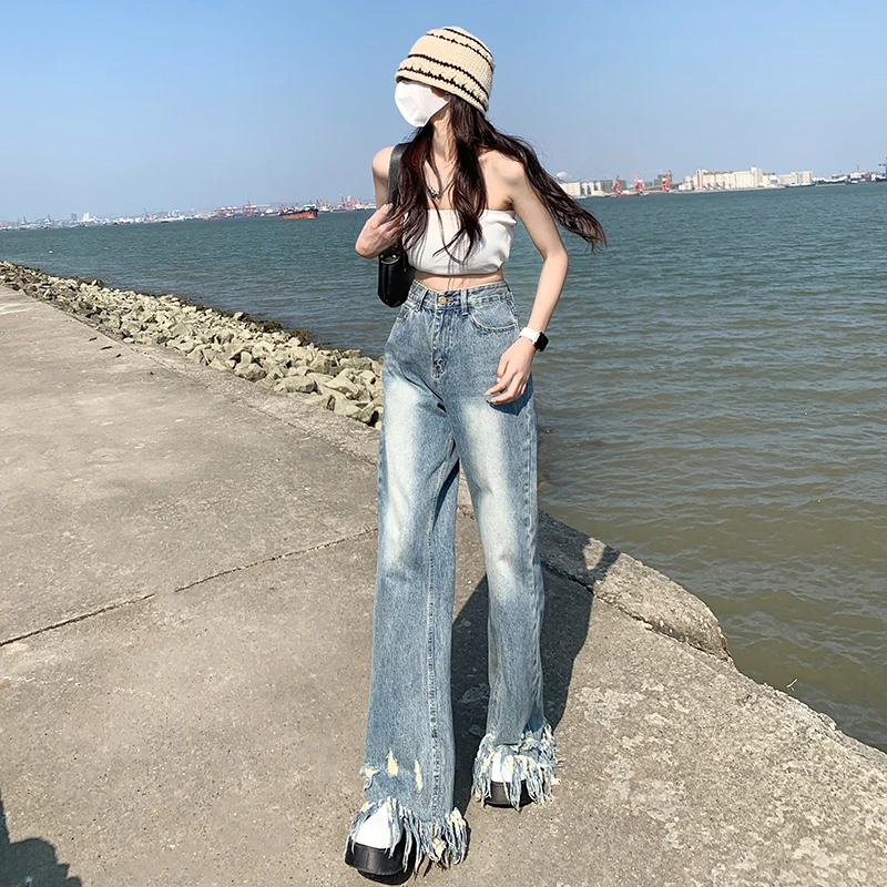 2022 new spring and summer ladies high street casual ripped jeans long spikes hairy hot girl wide leg pants 
2022 new spring and summer ladies high street casual ripped jeans long spikes hairy hot girl wide leg pants