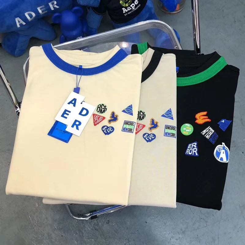 Authentic Ader Rror OEM Supply Medal Embroidery Color Matching Irregular Contrast Color T-shirt Men and Women Casual Short sl...
Authentic Ader Rror OEM Supply Medal Embroidery Color Matching Irregular Contrast Color T-shirt Men and Women Casual Short sl...