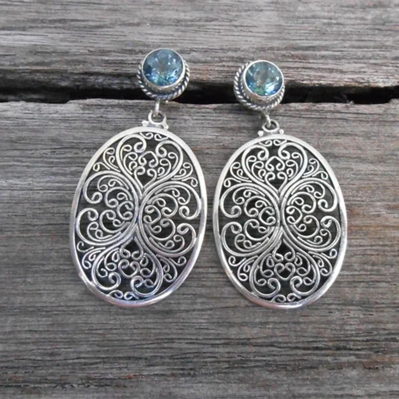 Vintage Creative Silver Color Metal Carving Hollow Flower Earrings Classic Round Inlaid Sea Blue Stone Dangle Earrings for Women
Vintage Creative Silver Color Metal Carving Hollow Flower Earrings Classic Round Inlaid Sea Blue Stone Dangle Earrings for Women