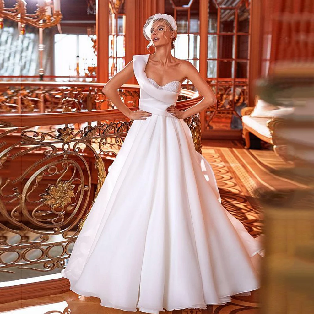 2022 A-Line Wedding Dresses Sleeveless One-Shoulder Robe De mariée White Lace Sweetheart Satin Bridal Gowns Sweep Train
2022 A-Line Wedding Dresses Sleeveless One-Shoulder Robe De mariée White Lace Sweetheart Satin Bridal Gowns Sweep Train
