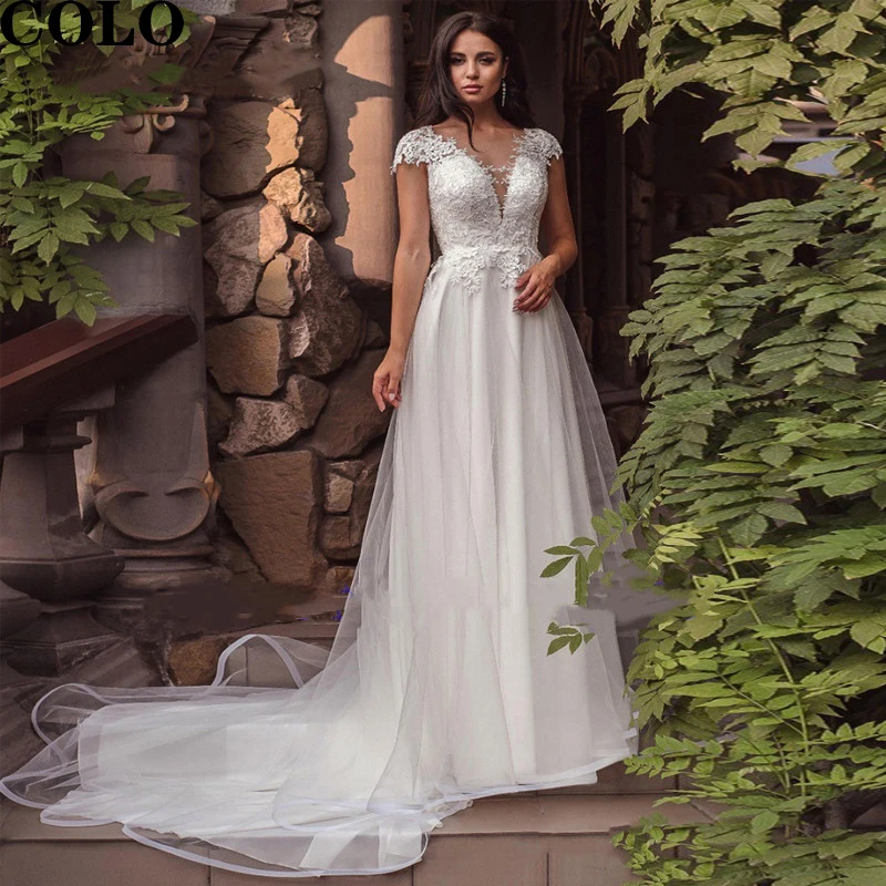 Wedding Dress 2022 Boho Tulle Wedding Dress Simple VNeck Cap Sleeves A-Line Lace Delicate Appliques Lace Up Backless Bridal Gown
Wedding Dress 2022 Boho Tulle Wedding Dress Simple VNeck Cap Sleeves A-Line Lace Delicate Appliques Lace Up Backless Bridal Gown