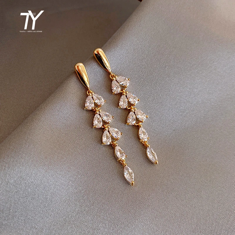 Shiny Zircon Tassel Leaf Shape Gold Color Earrings For Womans New Fashion Jewelry Wedding Party Unusual Girl's Luxury Earrings
Shiny Zircon Tassel Leaf Shape Gold Color Earrings For Womans New Fashion Jewelry Wedding Party Unusual Girl's Luxury Earrings