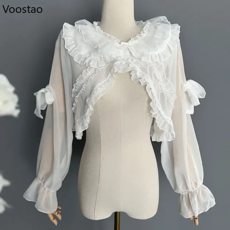 Japanese Sweet Lolita Chiffon Shawl Tops Women Elegant Ruffles Mesh Fairy Cardigan Girls Kawaii Cute Bow Princess Lace Ponchos
Japanese Sweet Lolita Chiffon Shawl Tops Women Elegant Ruffles Mesh Fairy Cardigan Girls Kawaii Cute Bow Princess Lace Ponchos