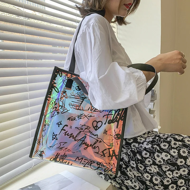 Large Graffiti Clear Tote Bag Shoulder Bag Laser PVC Jelly Handbags and Purses Fashion Letter Shopper Bags for Women 2022 Clutch
Large Graffiti Clear Tote Bag Shoulder Bag Laser PVC Jelly Handbags and Purses Fashion Letter Shopper Bags for Women 2022 Clutch