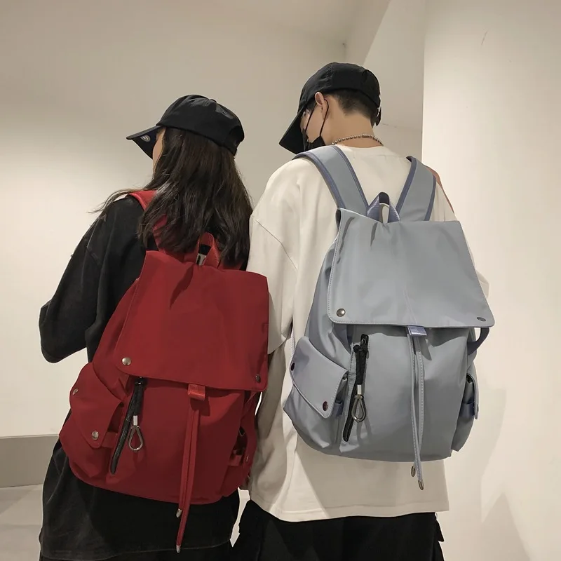 Simple Personality Couple Backpack 2022 New Design Waterproof Nylon Schoolbag Retro Flap Drawstring Multi-pocket Backpacks
Simple Personality Couple Backpack 2022 New Design Waterproof Nylon Schoolbag Retro Flap Drawstring Multi-pocket Backpacks
