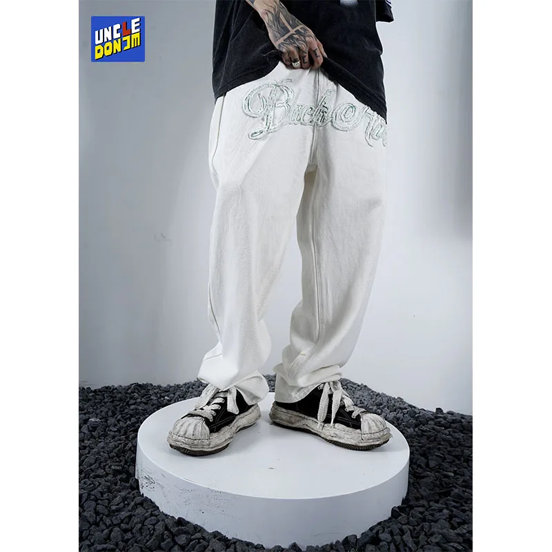 UNCLEDONJM Embroidered washed denim trousers distressed jeans hip hop baggy jeans streetwear men designer jeans for men
UNCLEDONJM Embroidered washed denim trousers distressed jeans hip hop baggy jeans streetwear men designer jeans for men