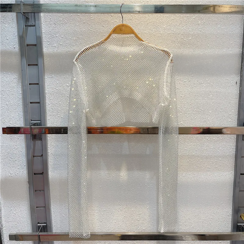 2022 new heavy Industry sparkling diamond hollowed-out knit blouse female niche irregular short chic jacket summer
2022 new heavy Industry sparkling diamond hollowed-out knit blouse female niche irregular short chic jacket summer