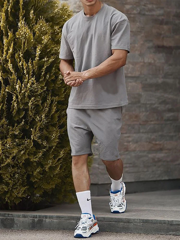 Summer Tracksuits Mens Short Sleeve T-shirts And Drawstring Tie-up Shorts Suits Solid Color Outfits Men Fashion Two Piece Sets
Summer Tracksuits Mens Short Sleeve T-shirts And Drawstring Tie-up Shorts Suits Solid Color Outfits Men Fashion Two Piece Sets