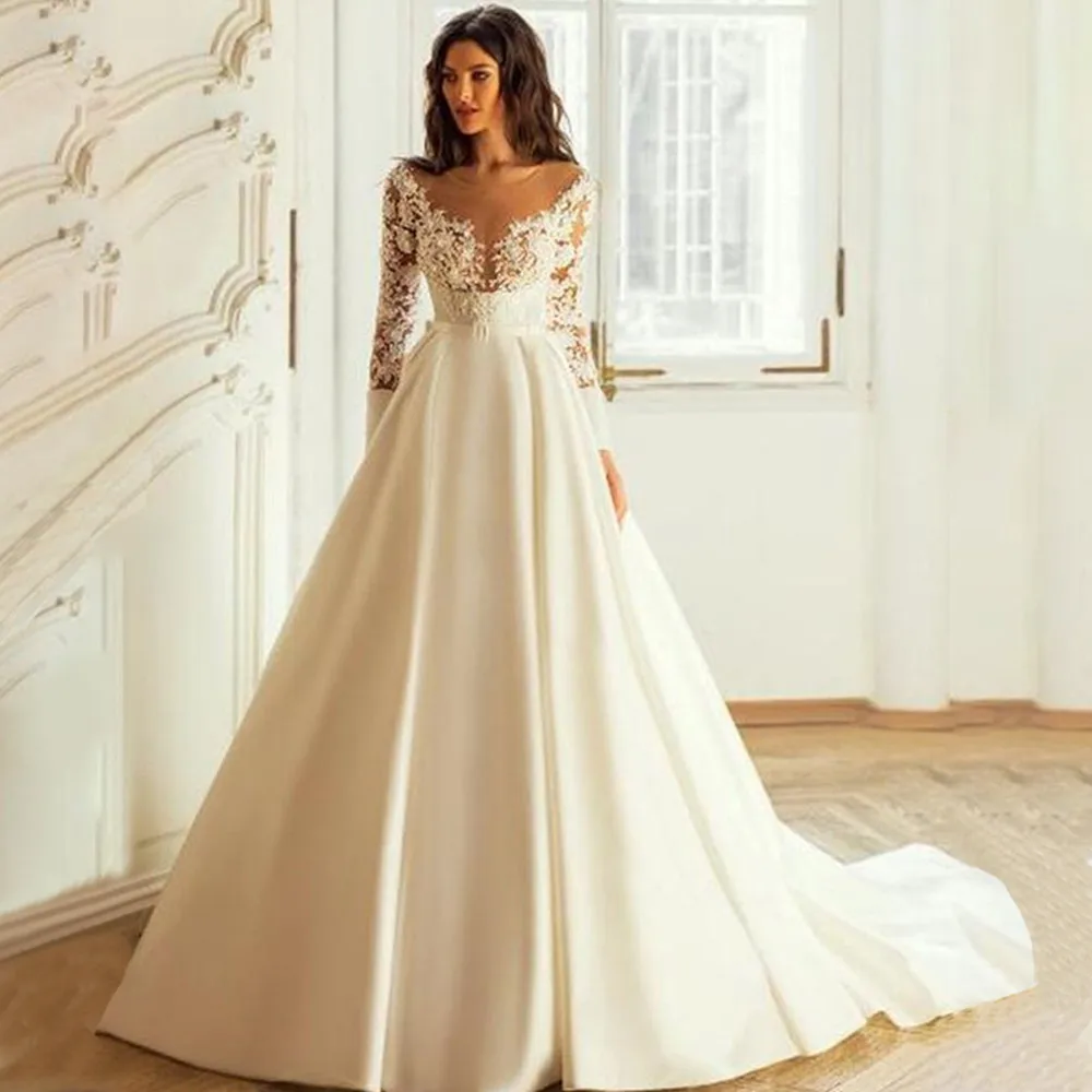 Fashion Ball Gown O-Neck Wedding Dress Elegant Long Sleeve Lace Appliques Bridal Gown Illusion Tulle Sashes Button Satin Train
Fashion Ball Gown O-Neck Wedding Dress Elegant Long Sleeve Lace Appliques Bridal Gown Illusion Tulle Sashes Button Satin Train