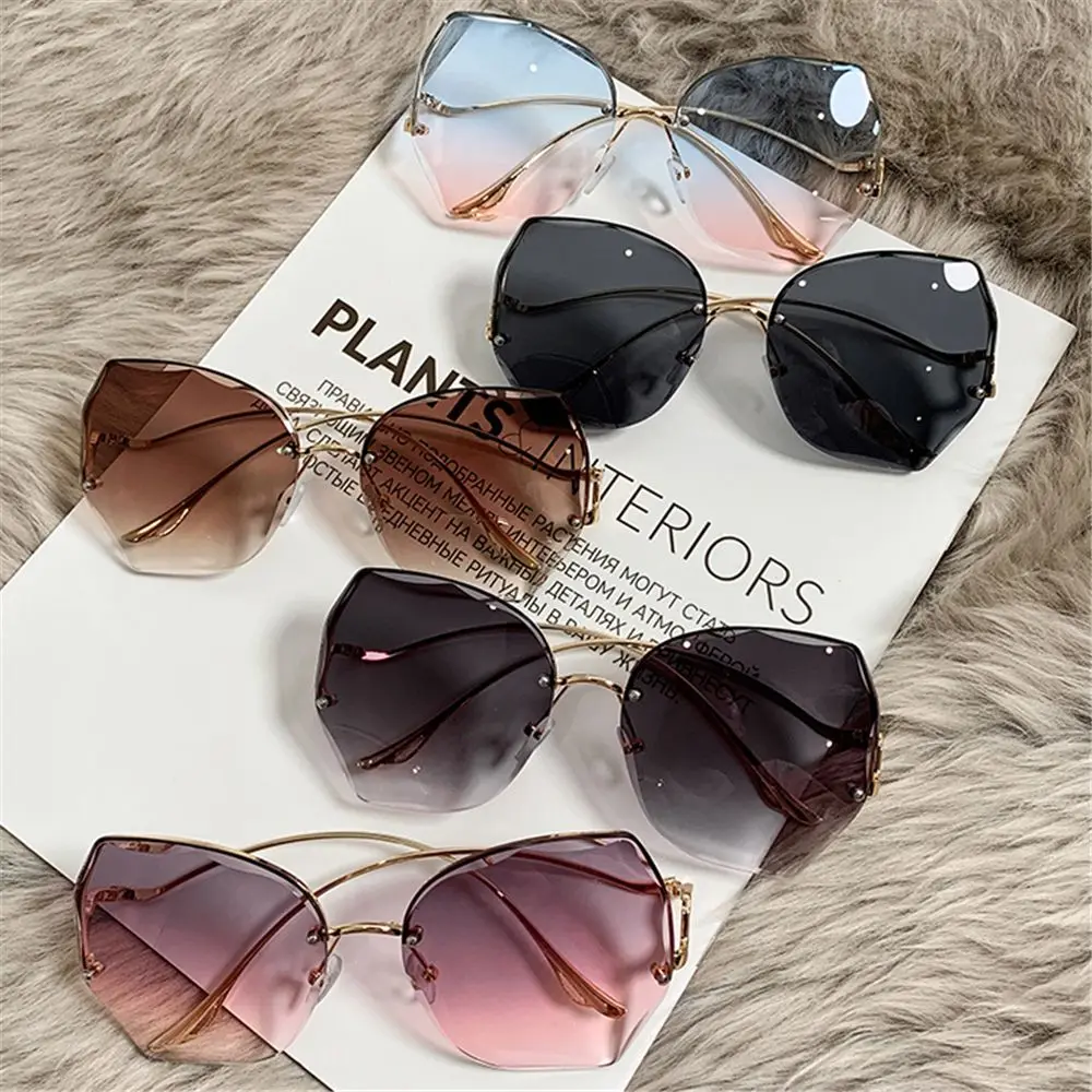 Fashion Frameless Eyewear Metal Curved Temples Vintage Rimless Sunglasses Sun Glasses Ocean Lens Gradient Sunglasses
Fashion Frameless Eyewear Metal Curved Temples Vintage Rimless Sunglasses Sun Glasses Ocean Lens Gradient Sunglasses