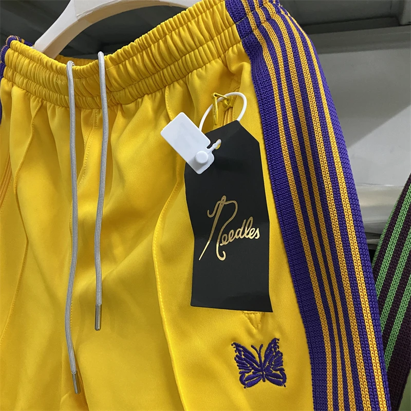 

Спортивные штаны для мужчин и женщин, гладкие трикотажные брюки с логотипом бабочки, фиолетовые полосатые, в стиле хип-хоп, желтые иглы