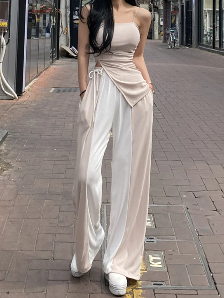 Женский комплект из жилета на шнуровке и брюк с высокой талией
Женский комплект из жилета на шнуровке и брюк с высокой талией