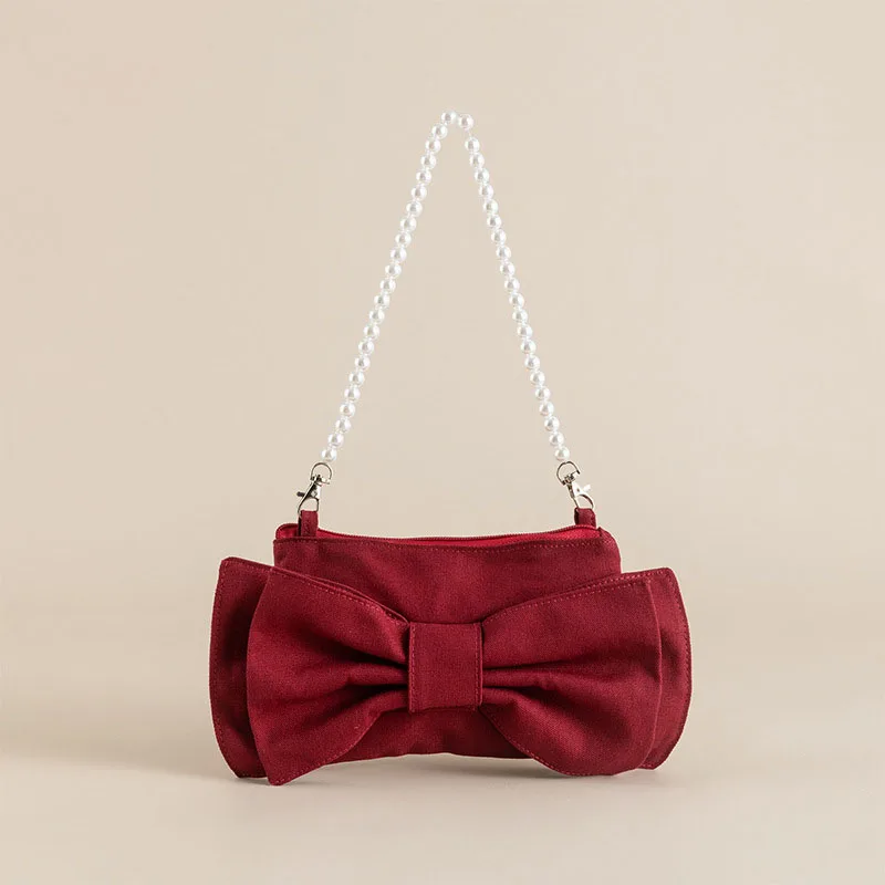 New Bow Pearl Chain Canvas Bag Design Shoulder Bag Fashion Cute Underarm Bag
New Bow Pearl Chain Canvas Bag Design Shoulder Bag Fashion Cute Underarm Bag