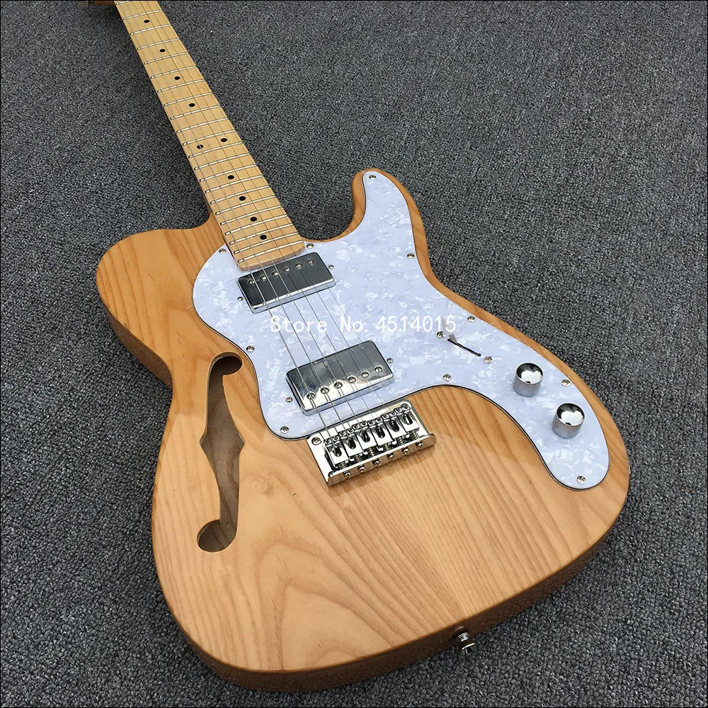 High-quality 6-string electric guitar with white wax xylophone body, half-empty core with F hole, and postage.
High-quality 6-string electric guitar with white wax xylophone body, half-empty core with F hole, and postage.