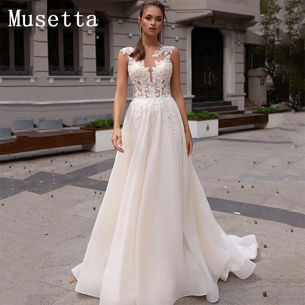 Musetta Vintage Appliqued Flower Wedding Dress A Line Sleeveless Nude Sheer Neck Floor Length Lace Brial Gowns 2022 Custom Made
Musetta Vintage Appliqued Flower Wedding Dress A Line Sleeveless Nude Sheer Neck Floor Length Lace Brial Gowns 2022 Custom Made