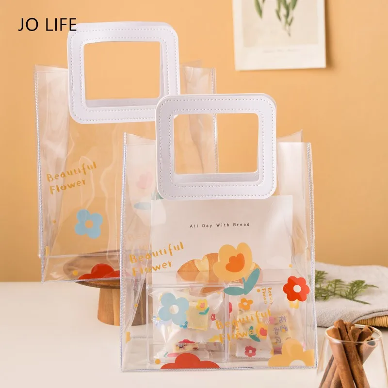 JO LIFE Transparent Gift Packaging Handbag PVC Square Handle Fashionable Cosmetic Bag Dessert Gift Wrapping Bag
JO LIFE Transparent Gift Packaging Handbag PVC Square Handle Fashionable Cosmetic Bag Dessert Gift Wrapping Bag