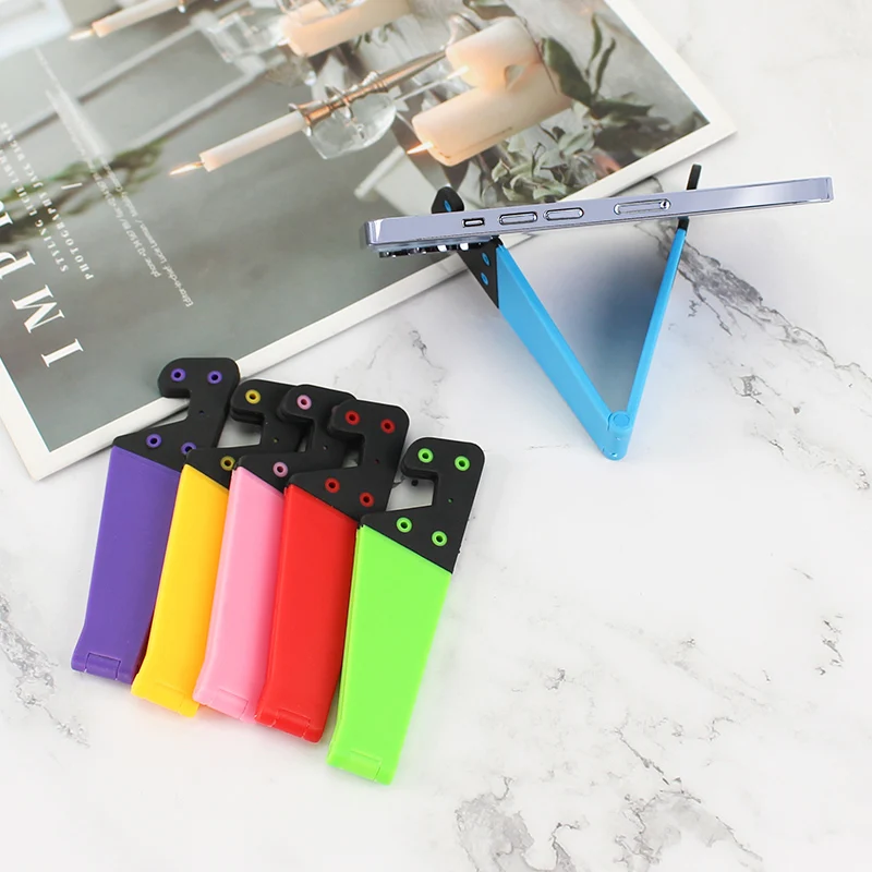 New V-Shaped Universal Foldable Mobile Cell Phone Stand Holder for IPhone IPad E-Reader Tablets Adjustable Support Phone Holder
New V-Shaped Universal Foldable Mobile Cell Phone Stand Holder for IPhone IPad E-Reader Tablets Adjustable Support Phone Holder