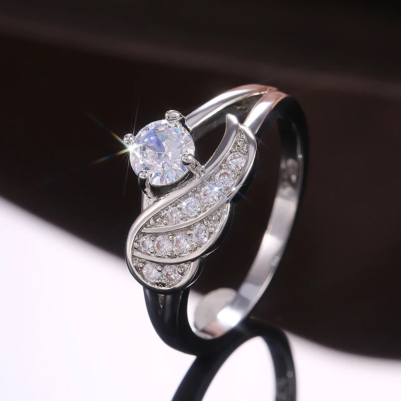 New Creative Cute Silver Plated Angel Wings Rings For Women Shine White CZ Stone Inlay Fashion Jewelry Wedding Party Gift Ring
New Creative Cute Silver Plated Angel Wings Rings For Women Shine White CZ Stone Inlay Fashion Jewelry Wedding Party Gift Ring