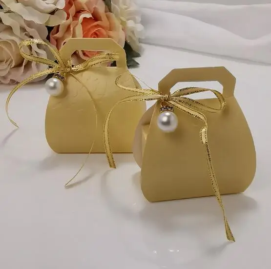 100Pcs Creative Gold Yellow Wedding Favors Candy Boxes Handbag Chocolate Box Party Supplies Gift Box With Faux Pearl
100Pcs Creative Gold Yellow Wedding Favors Candy Boxes Handbag Chocolate Box Party Supplies Gift Box With Faux Pearl