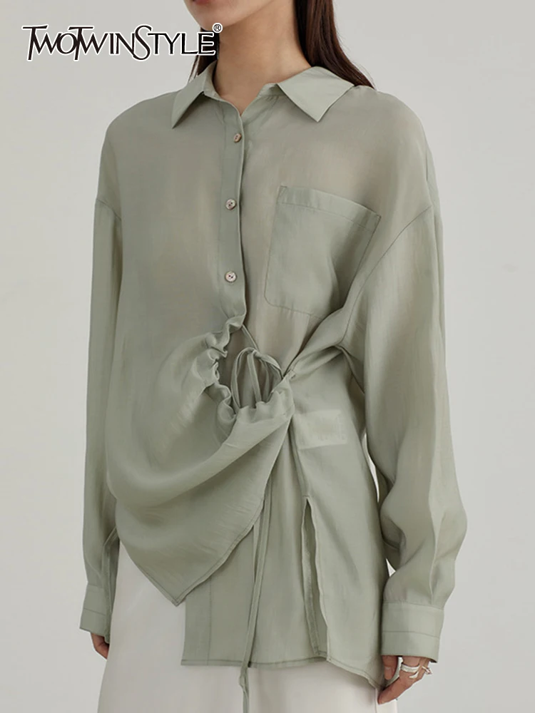 TWOTWINSTYLE Solid Button Blouse For Women Lapel Long Sleeve Spliced Strappy Minimalist Shirt Summer Female Fashion Clothing New
TWOTWINSTYLE Solid Button Blouse For Women Lapel Long Sleeve Spliced Strappy Minimalist Shirt Summer Female Fashion Clothing New