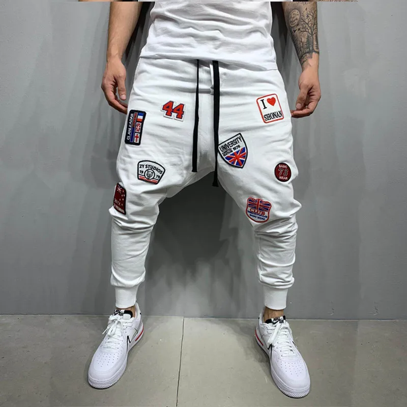 Модные мужские штаны-шаровары с нашивками в стиле хип-хоп, стиль Techwear, мужские повседневные белые спортивные брюки для спортзала
Модные мужские штаны-шаровары с нашивками в стиле хип-хоп, стиль Techwear, мужские повседневные белые спортивные брюки для спортзала