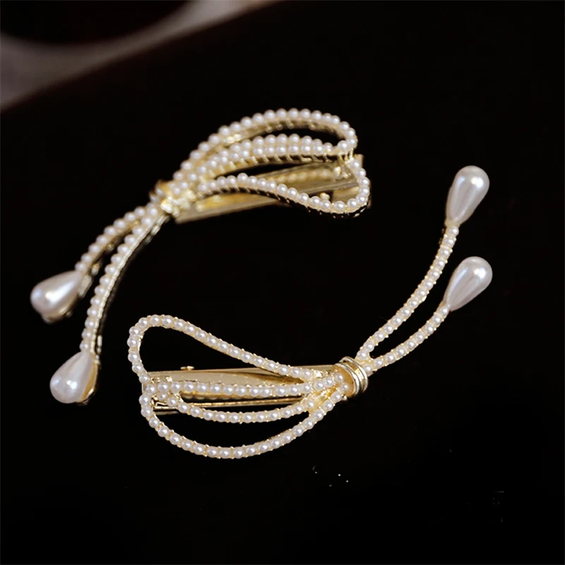 New Japanese and Korean Design Pearl Hairpin Women's Personality Simple Bowknot Clip Duck Mouth Clip Hair Ornament
New Japanese and Korean Design Pearl Hairpin Women's Personality Simple Bowknot Clip Duck Mouth Clip Hair Ornament