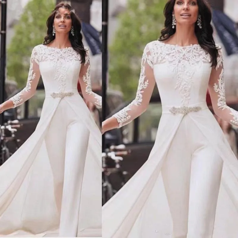 White Wedding Jumpsuits Pants Long Sleeve Lace Satin With Overskirts Beads Crystals Plus Size Bridal Gowns Vestidos De Novia
White Wedding Jumpsuits Pants Long Sleeve Lace Satin With Overskirts Beads Crystals Plus Size Bridal Gowns Vestidos De Novia