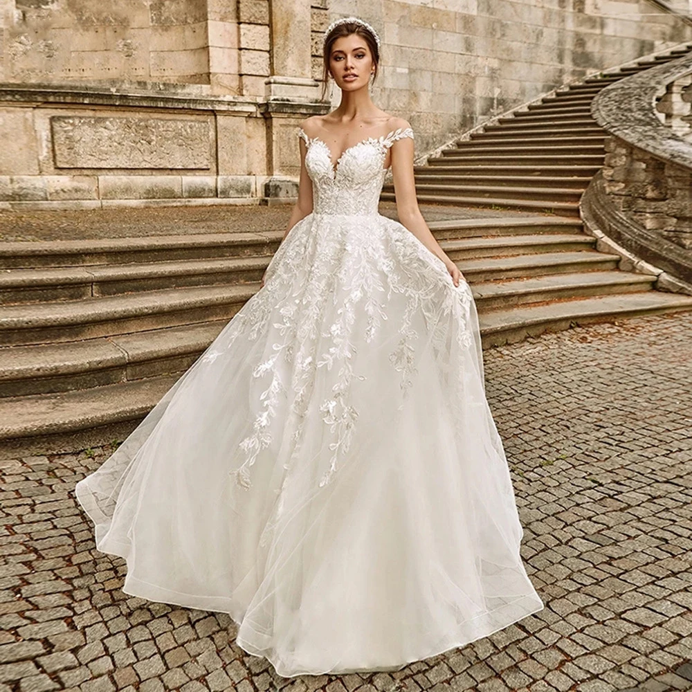 Sexy V Neck Lace Seaside Beach Wedding Dress Boho Sheer Spoon Button Bridal Dress Applique Princess Wedding Dress Cap Sleeves Fl
Sexy V Neck Lace Seaside Beach Wedding Dress Boho Sheer Spoon Button Bridal Dress Applique Princess Wedding Dress Cap Sleeves Fl