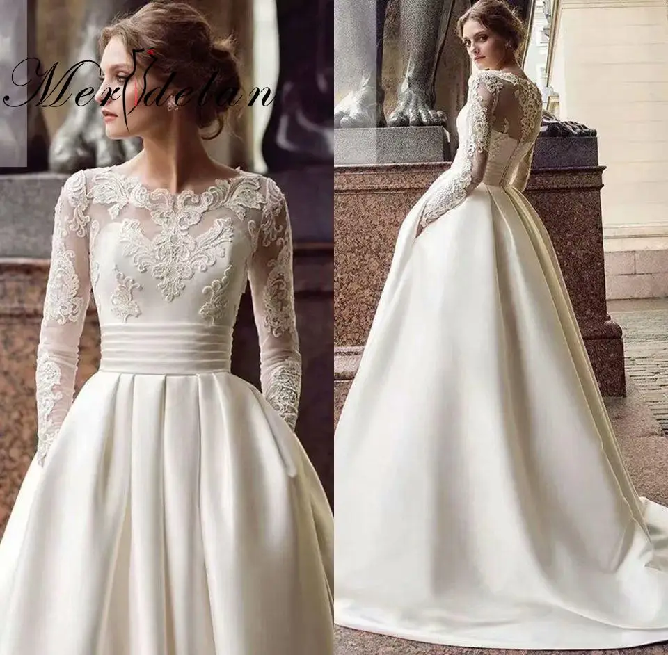 Merdelan A-Line Wedding Dresses Jewel Neck Floor Length Lace Satin Long Sleeve Formal Luxurious with Pleats Beading Appliques
Merdelan A-Line Wedding Dresses Jewel Neck Floor Length Lace Satin Long Sleeve Formal Luxurious with Pleats Beading Appliques