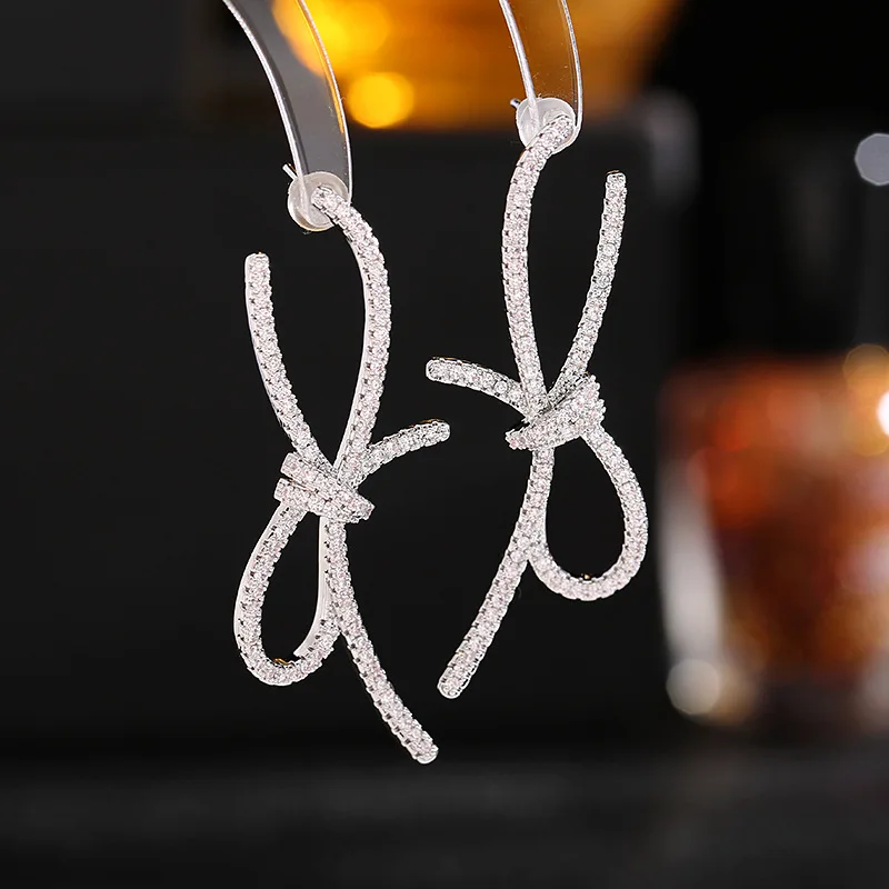 Super Fairy Fashion Geometric White Cubic Zirconia Stone Silver Color Lovely Streamer Bow Ladies Earring Jewelry Gift
Super Fairy Fashion Geometric White Cubic Zirconia Stone Silver Color Lovely Streamer Bow Ladies Earring Jewelry Gift