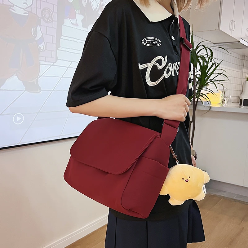 Fashion Student Shoulder Bag Waterproof Nylon Women School Bag Solid Color Casual Messenger Bag Cute Pendant Female Travel Bag
Fashion Student Shoulder Bag Waterproof Nylon Women School Bag Solid Color Casual Messenger Bag Cute Pendant Female Travel Bag
