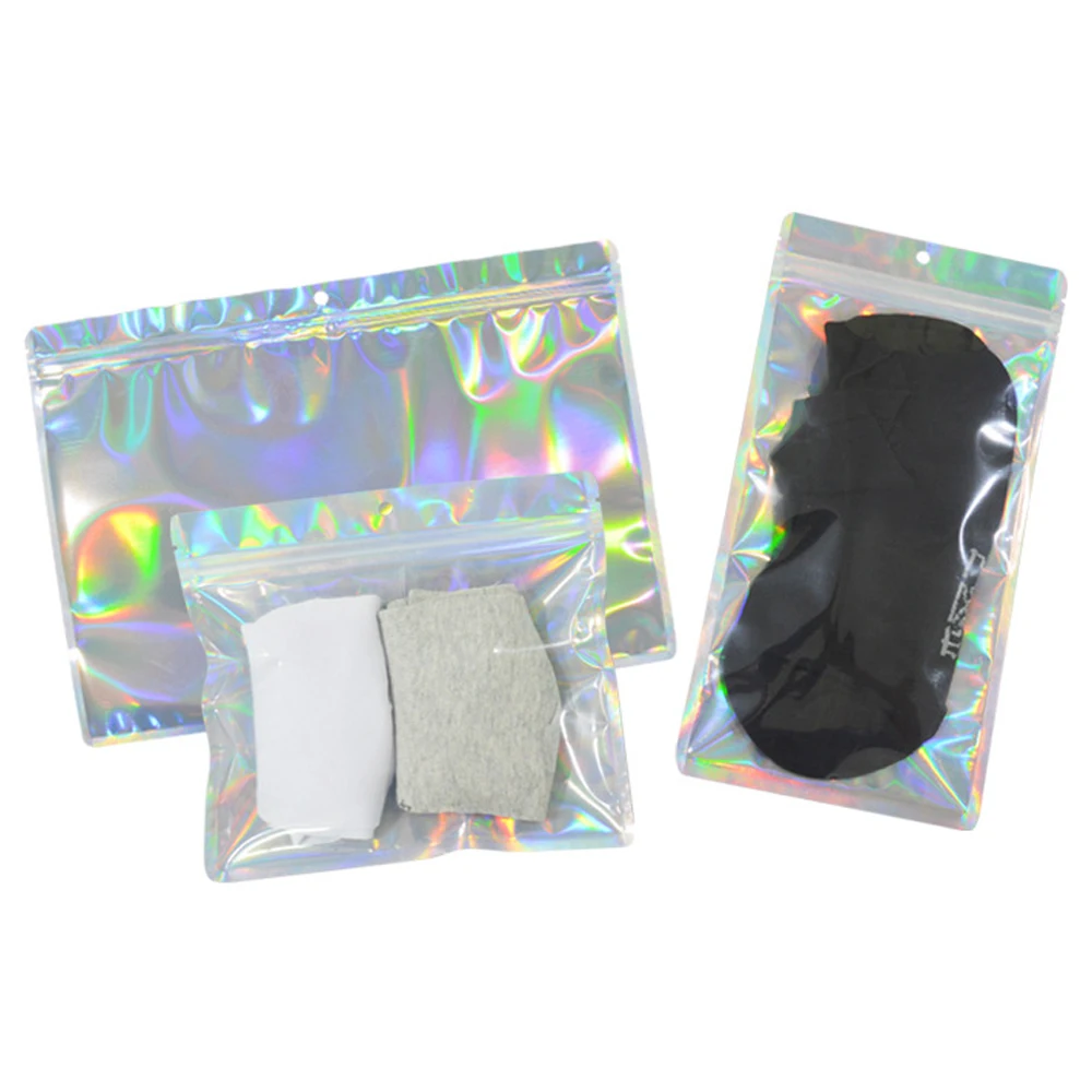 100Pcs Aluminum Foil Holographic Pouches Hang Hole Zip Lock Clear Plastic Packaging Bag for Underwear Clothing Socks Shirt Gift
100Pcs Aluminum Foil Holographic Pouches Hang Hole Zip Lock Clear Plastic Packaging Bag for Underwear Clothing Socks Shirt Gift