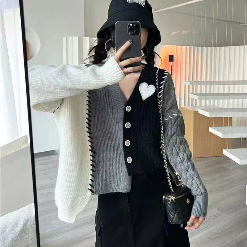 Chic sweater new short V-neck knit cardigan in autumn and winter women's irregular design feeling coat tide
Chic sweater new short V-neck knit cardigan in autumn and winter women's irregular design feeling coat tide