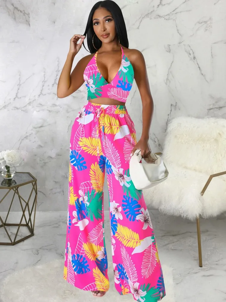 Женский комплект из 2 предметов с цветочным принтом, укороченный топ с запахом на груди и открытой спиной и длинные брюки с широкими штанинами и завязками на талии 
Женский комплект из 2 предметов с цветочным принтом, укороченный топ с запахом на груди и открытой спиной и длинные брюки с широкими штанинами и завязками на талии