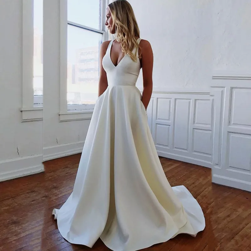 Simple Satin V-Neck Wedding Dresses 2021 Tank Pockets Sleeveless Sweep Train Ball Gown Robe De Mariee Zipper Back Custom Made
Simple Satin V-Neck Wedding Dresses 2021 Tank Pockets Sleeveless Sweep Train Ball Gown Robe De Mariee Zipper Back Custom Made