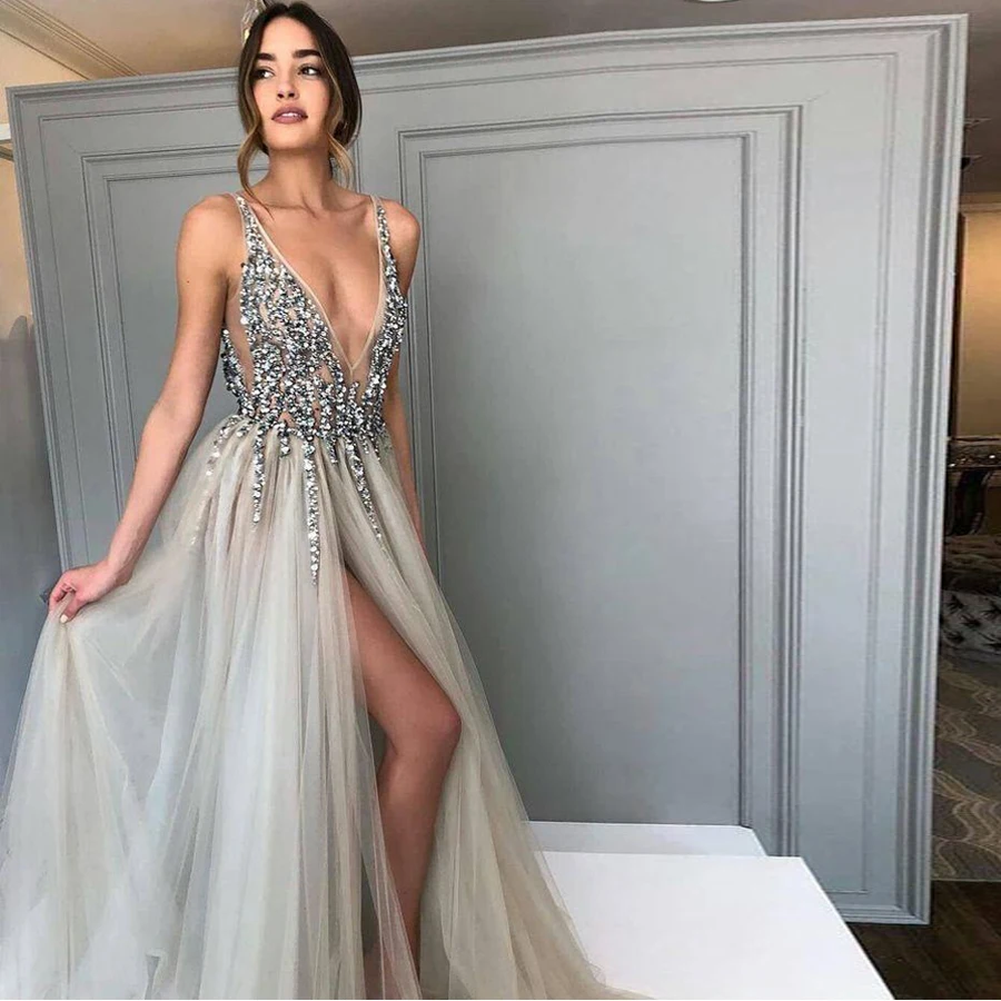 Silver Sparkly Prom Dress Long V neck Beaded A-line Spaghetti Straps Grey/Silver Front Slit Crystals Evening Dress Famous Design
Silver Sparkly Prom Dress Long V neck Beaded A-line Spaghetti Straps Grey/Silver Front Slit Crystals Evening Dress Famous Design