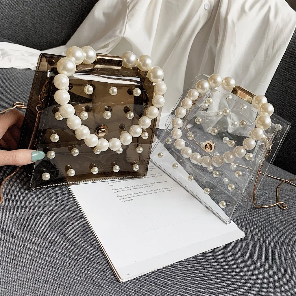 Messenger Bags Women 2021 PVC Transparent Pearl Handbag Shoulder Bag Clear Jelly Purse Tote Elegant Fashion Ladies Crossbody Bag
Messenger Bags Women 2021 PVC Transparent Pearl Handbag Shoulder Bag Clear Jelly Purse Tote Elegant Fashion Ladies Crossbody Bag