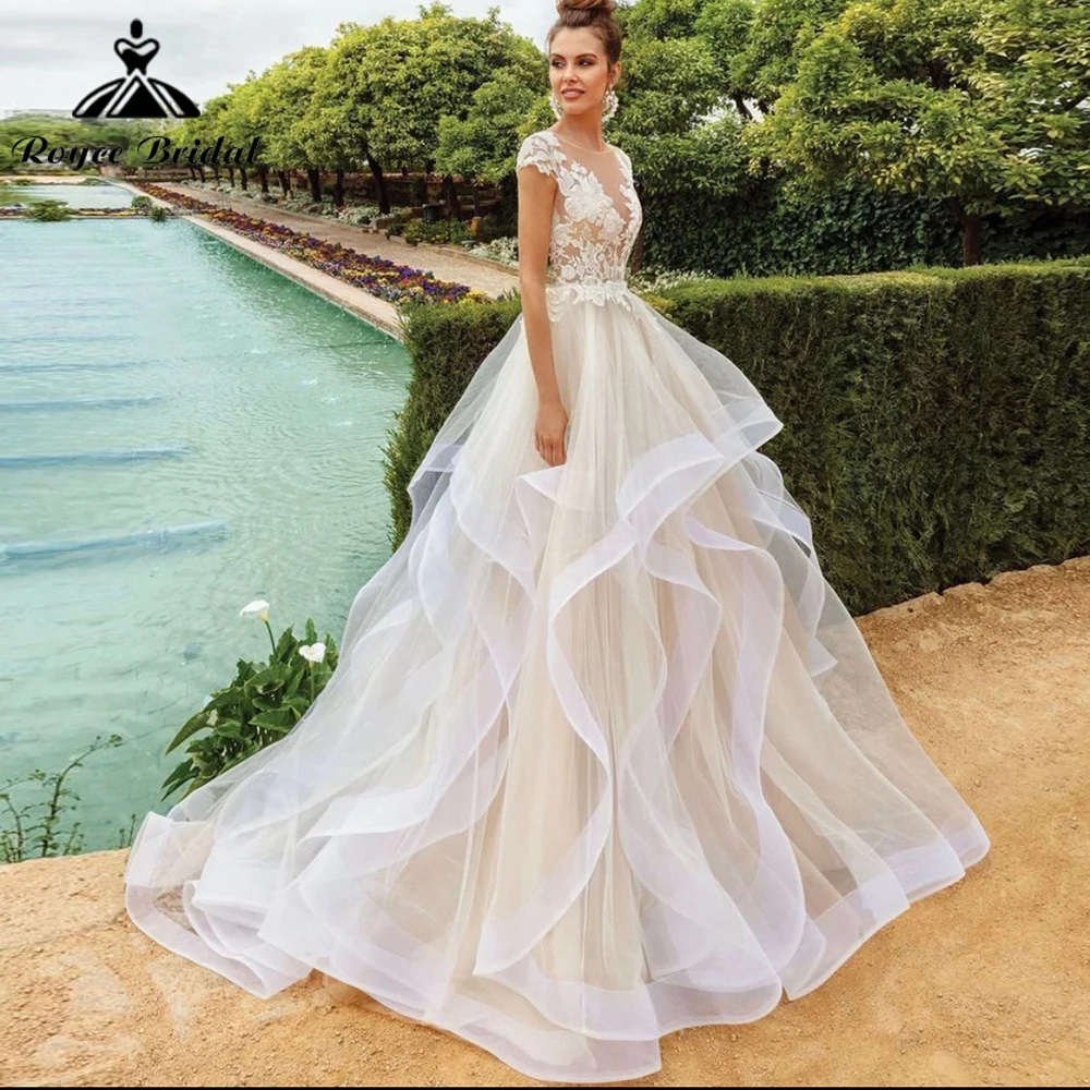 

Princess Ball Gown Wedding Dress 2023 Sheer Neck Cap Sleeve Button Lace Appliques Tiered Sweep Train Bride Gown Vestido De Noiva
