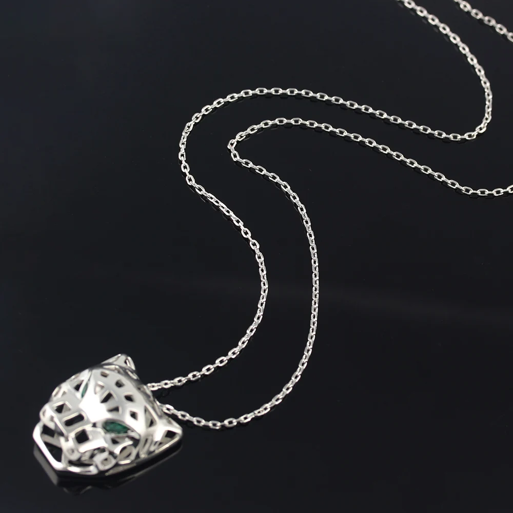 

Роскошное ожерелье с подвеской в виде головы леопарда с зелеными глазами