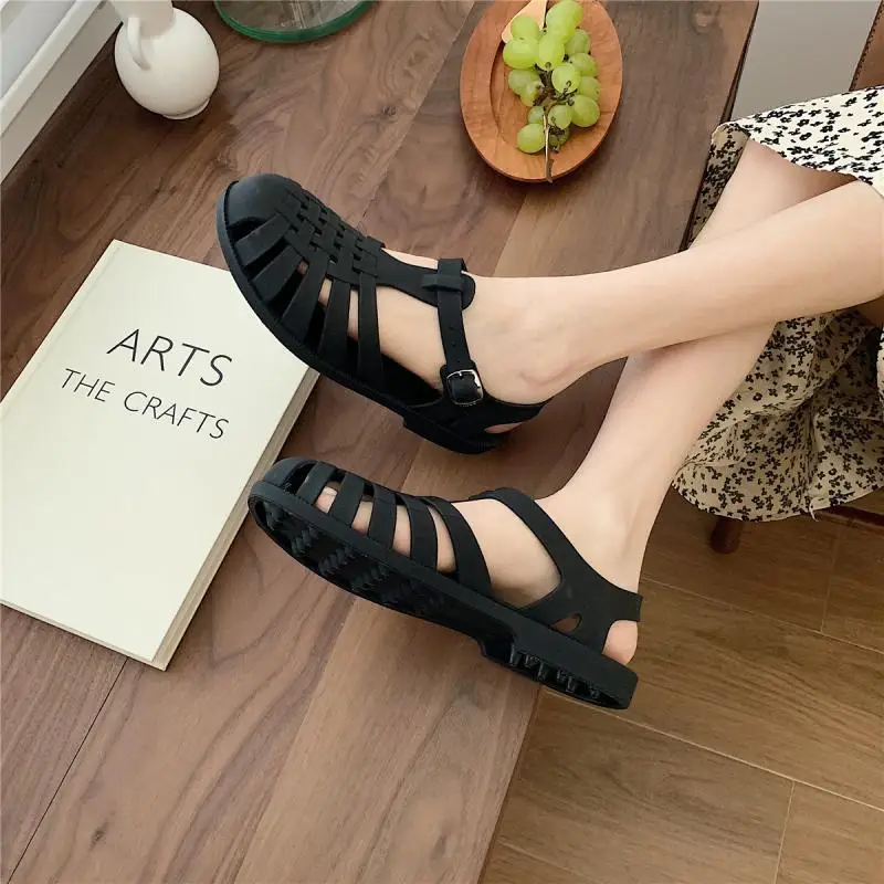 

Wholesale 2022 New Women's Solid Color Roman Style Sandals Summer Retro Woven Hollow PVC Flat Sandals For Women