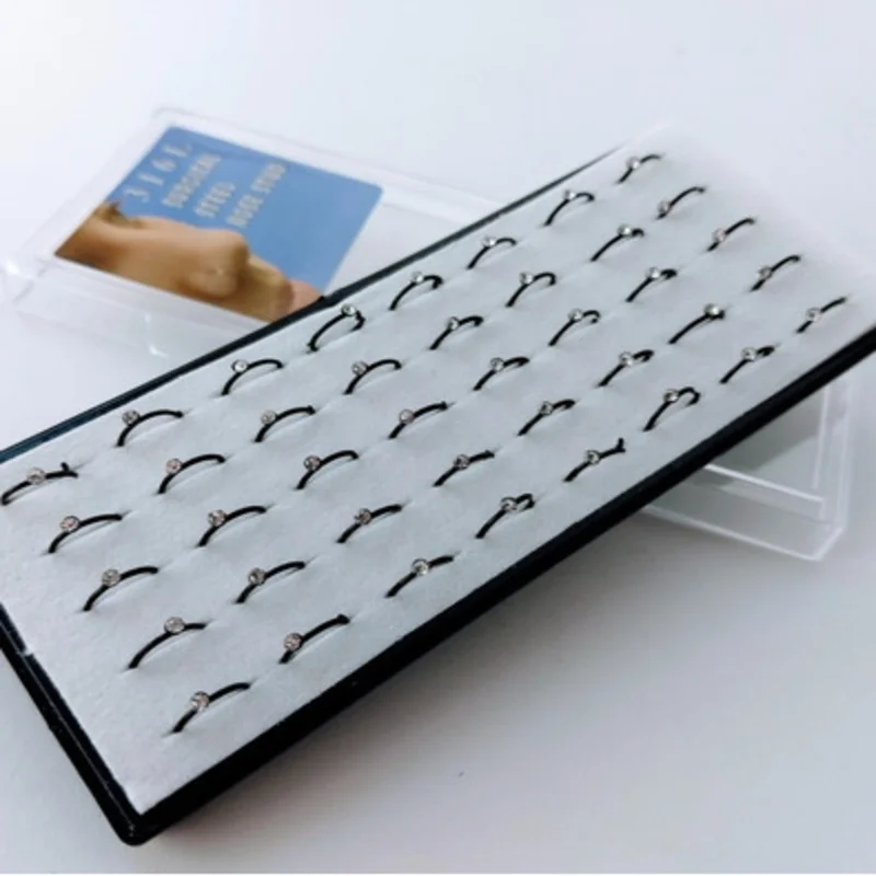 

Kit C/40 Nose Piercing-White Stone Black Ring