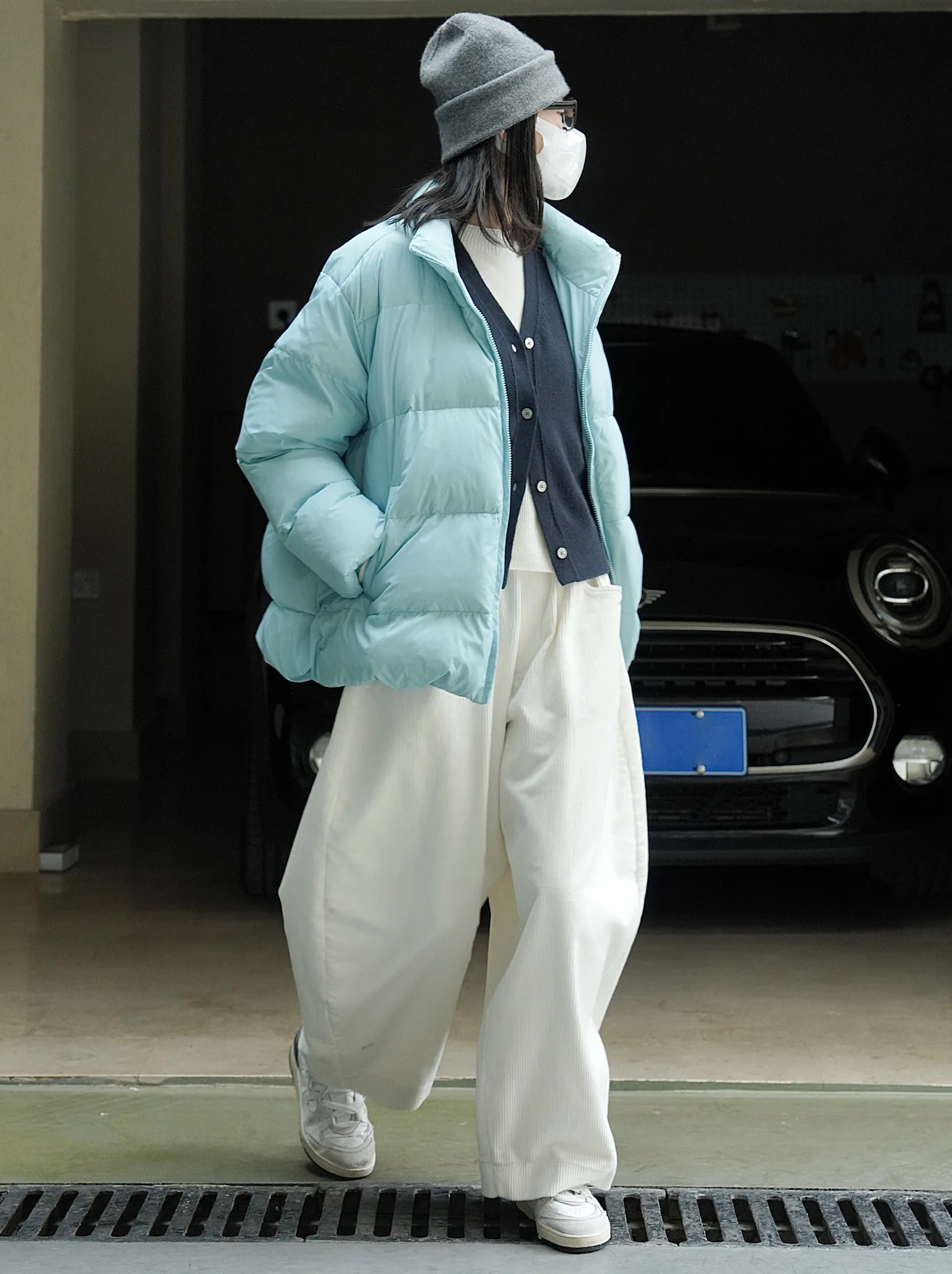 woman warm winter coat light blue and black enlarge