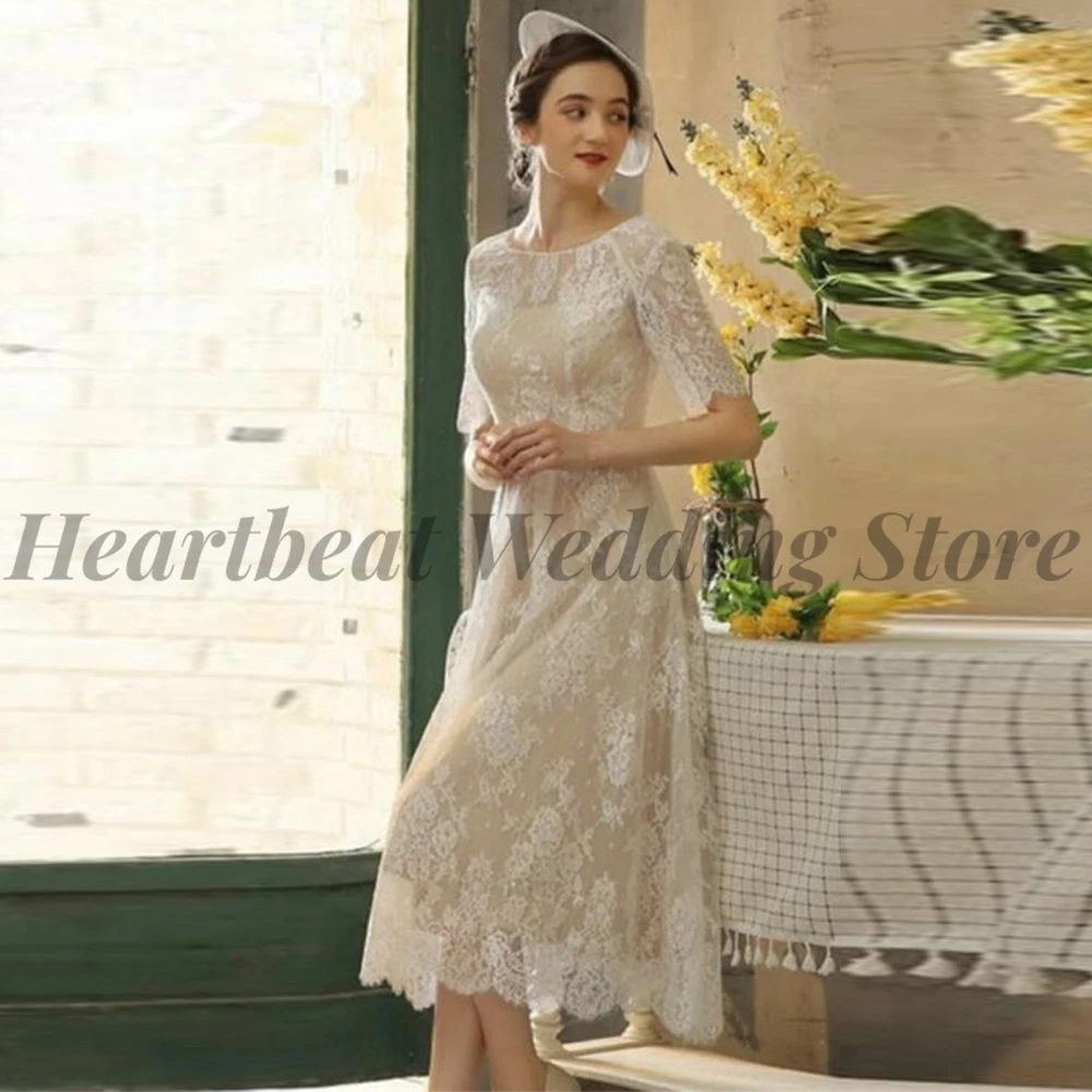

Elegant Tea-Length 2023 Wedding Dress with Jewel Short Sleeve Button Back Applique Sequins for Ladies A-Line Robe De Mariee