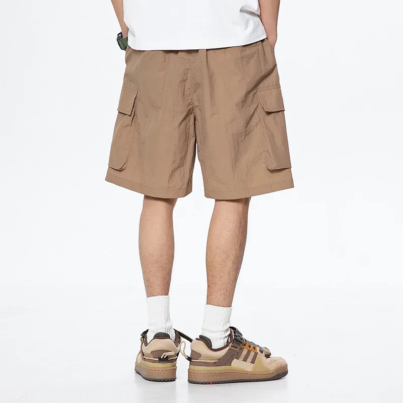 Sports shorts men's new summer men's loose straight tube fashion work clothes leisure medium pants quick drying beach shorts