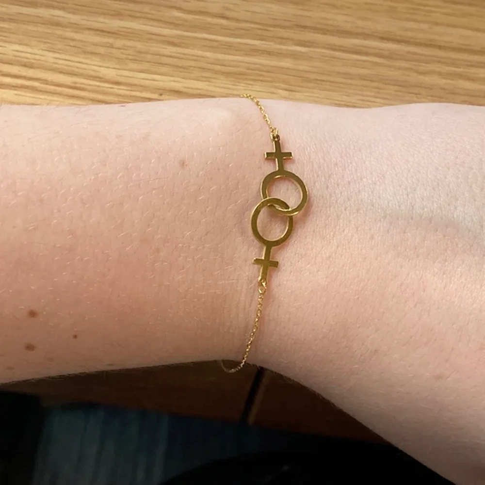 Женский браслет из нержавеющей стали с символом двойной венерины