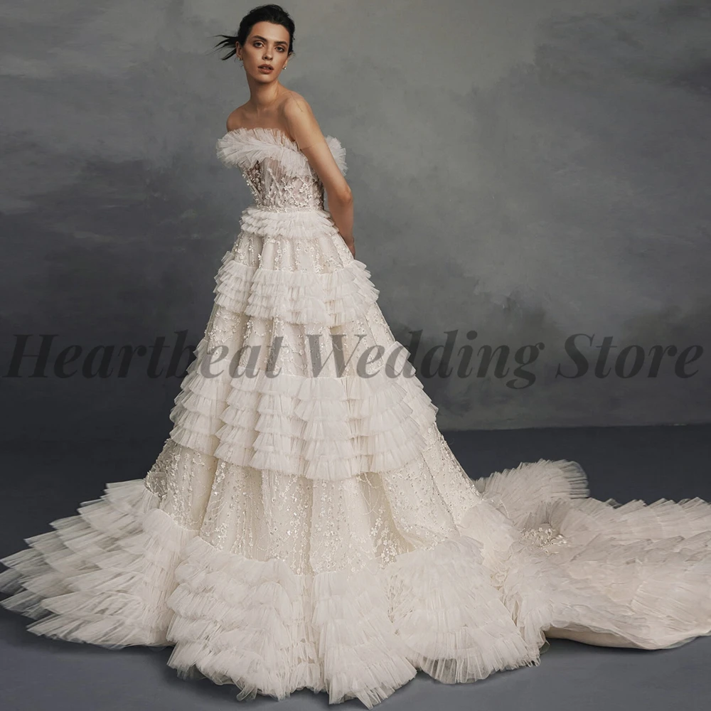 

2023 A-Line Awesome Wedding Dress for Brides with Ruffles Applique Pearls Sequins Court Train Sleeveless Strapless Button Back