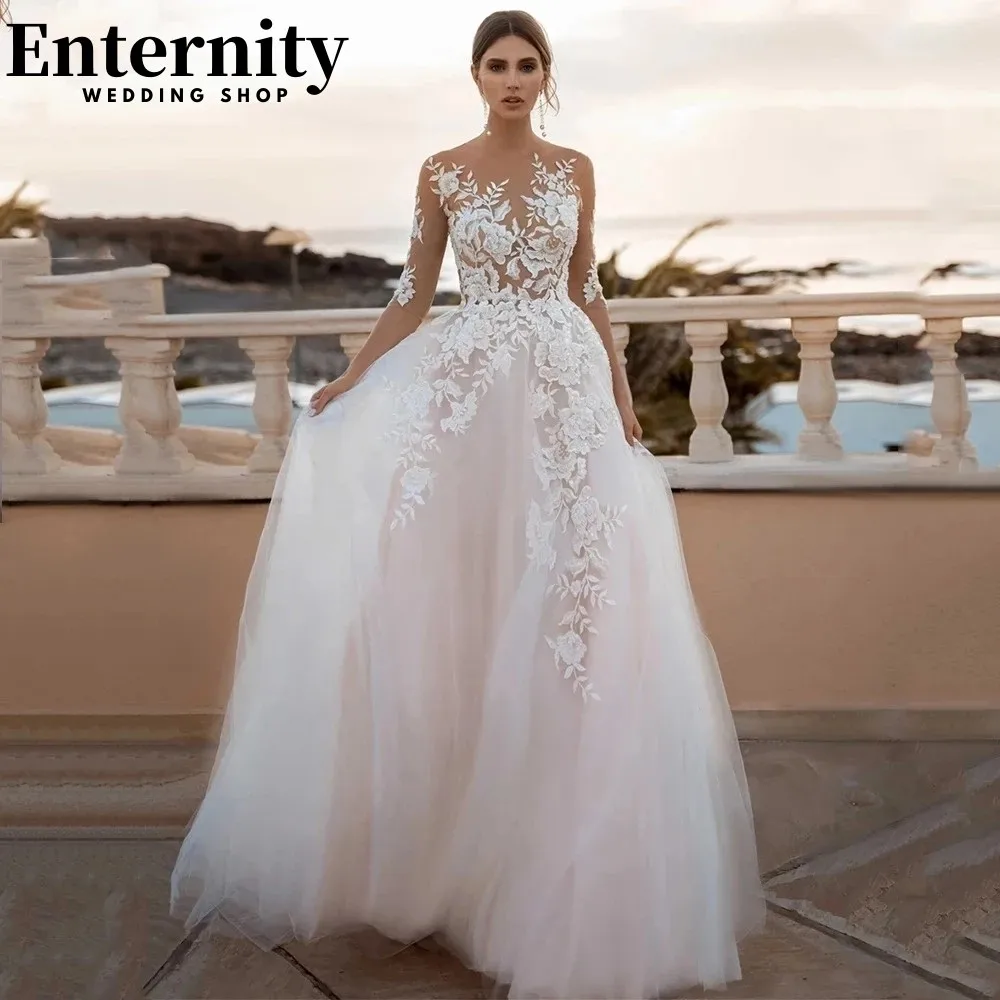 

Intriguing Sheer O Neck Wedding Dress Pink Long Sleeves Bridal Gowns Backless With Buttons Wedding Gowns Vestido De Novia